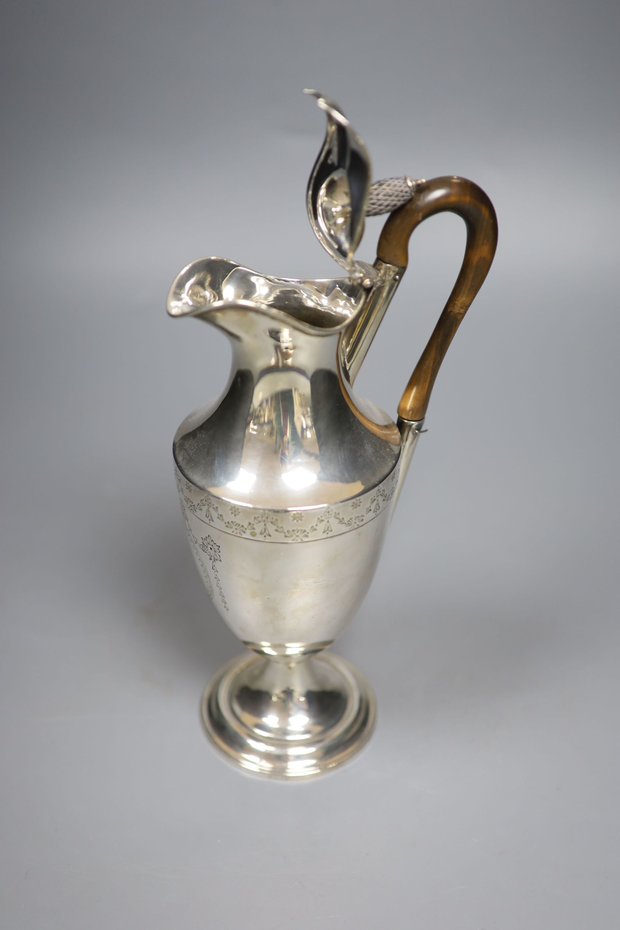 A late Victorian silver hot water pot, London, 1883, makers mark rubbed, height 26.1cm, gross 12.5oz.